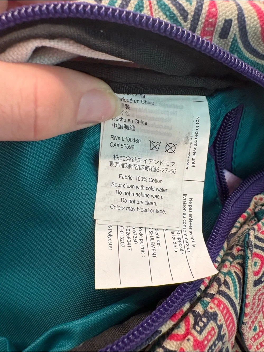 Kavu Geometric Sling Pack in Cream, Green & Red with Purple Accents